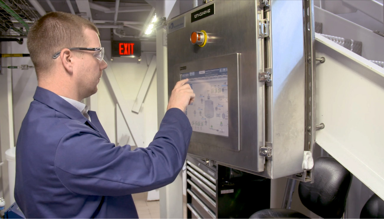 Life sciences professional using Ignition platform on a tablet in a laboratory.