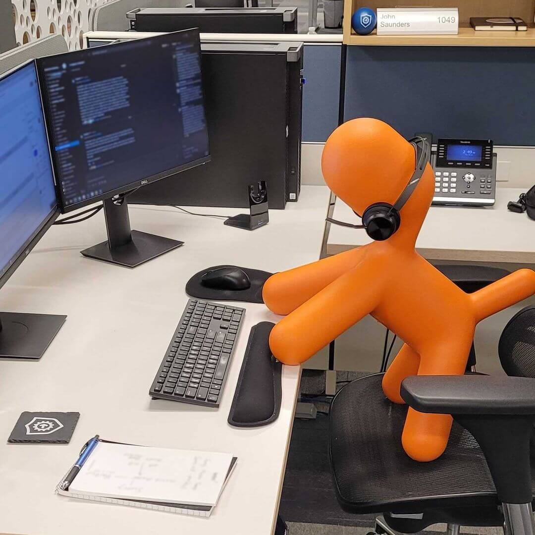 Software Support Engineer John Saunders seems to have lost his seat! It looks like 🧡 Iggy the Ignition Dog 🐶 took over his desk and decided to answer a few calls. Good thing Iggy is amazing at Ignition, although there might be a bit of an issue since he doesn't have thumbs. 🤔